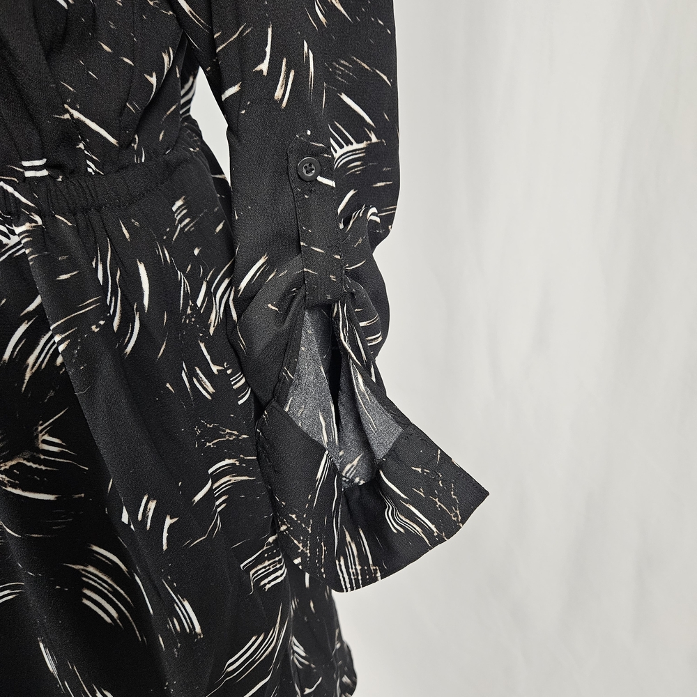 Elegant Black Patterned Dress with Pockets Size 6 photo 2