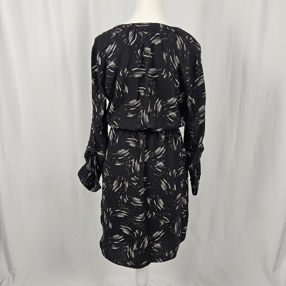 Elegant Black Patterned Dress with Pockets Size 6 photo 7