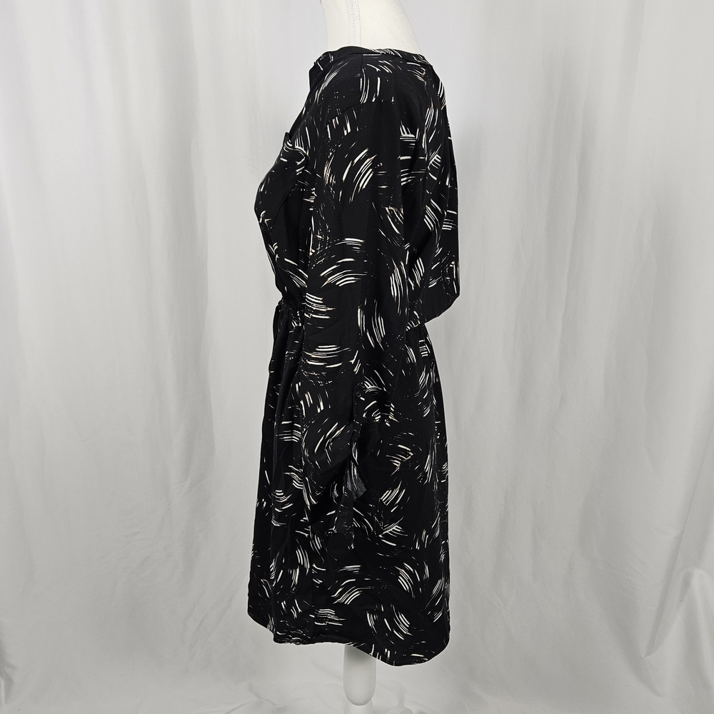 Elegant Black Patterned Dress with Pockets Size 6 photo 8